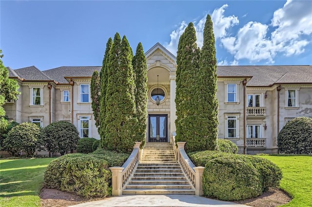 9620 Cedar Grove Rd, Chattahoochee Hills, GA 30213 - view of front of home with french doors, a front yard, and roof with shingles