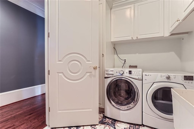 9620 Cedar Grove Rd, Chattahoochee Hills, GA 30213 - washroom featuring washing machine and clothes dryer, cabinet space, wood finished floors, and baseboards