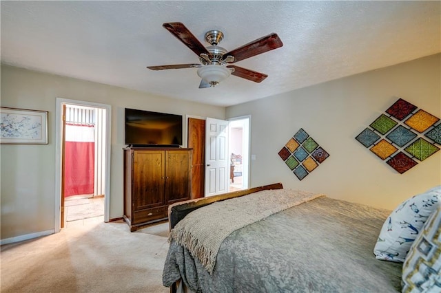 bedroom featuring ceiling fan and light carpet