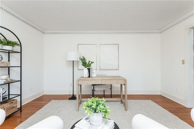 office area with wood finished floors and baseboards