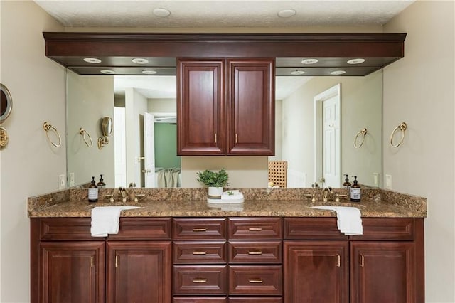 full bath with double vanity and a sink