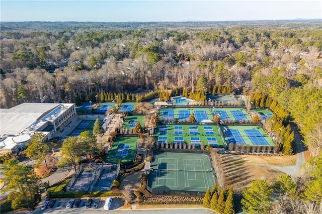 birds eye view of property with a view of trees