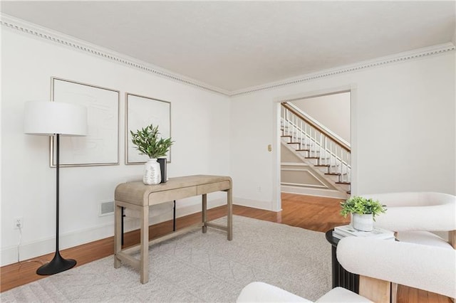 interior space with baseboards and wood finished floors