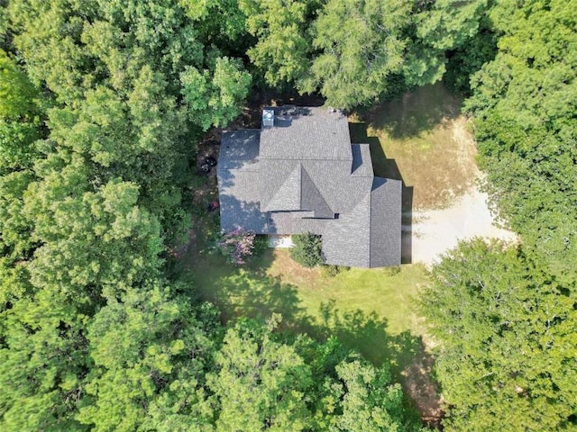 birds eye view of property with a wooded view