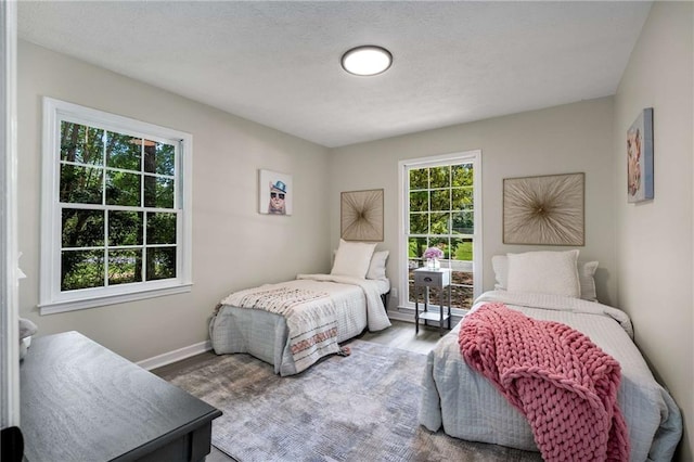 2694 Hickory Valley Dr, Snellville, GA 30078 - bedroom with baseboards and wood finished floors