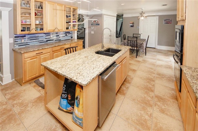 1120 Carl Bethlehem Rd, Winder, GA 30680 - kitchen featuring appliances with stainless steel finishes, an island with sink, light brown cabinets, ceiling fan, and backsplash