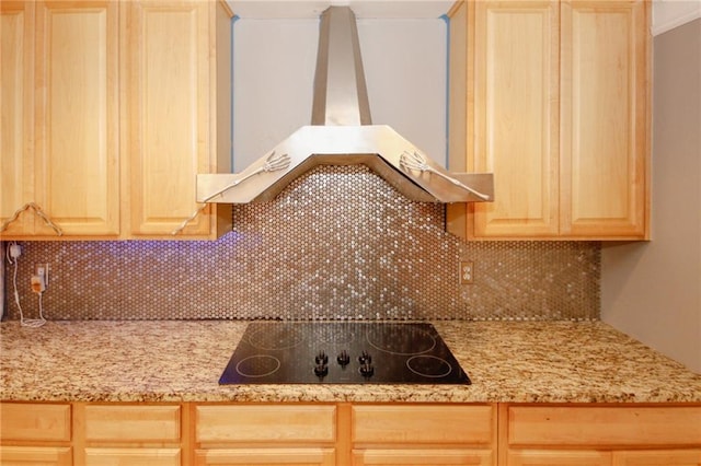 1120 Carl Bethlehem Rd, Winder, GA 30680 - kitchen with island exhaust hood, black electric cooktop, light brown cabinetry, backsplash, and light stone countertops