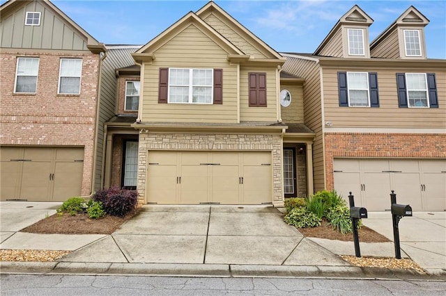 2647 Sardis Chase Ct, Buford, GA 30519 - view of property featuring an attached garage, concrete driveway, and board and batten siding