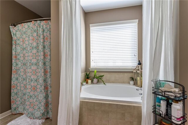 carpeted bedroom with a tray ceiling, ornamental molding, and ceiling fan