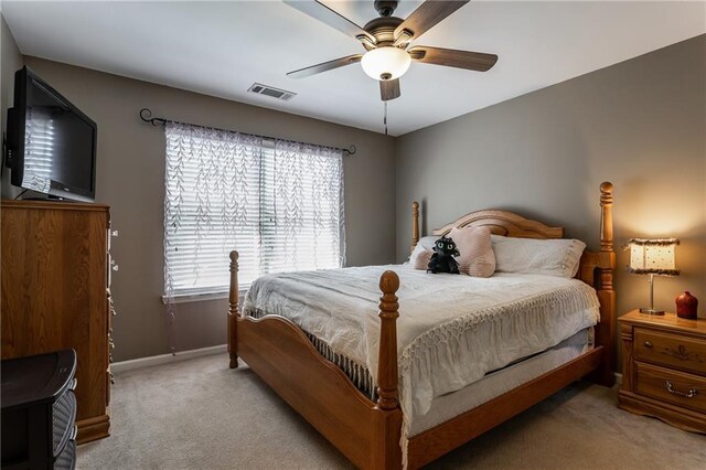 spacious closet featuring light colored carpet