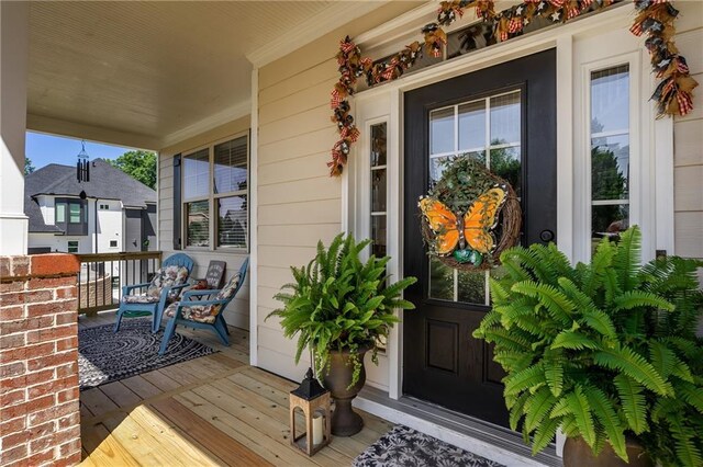 doorway to property with a porch