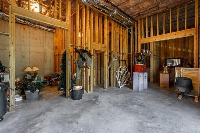 foyer featuring hardwood / wood-style flooring, ornamental molding, and a high ceiling