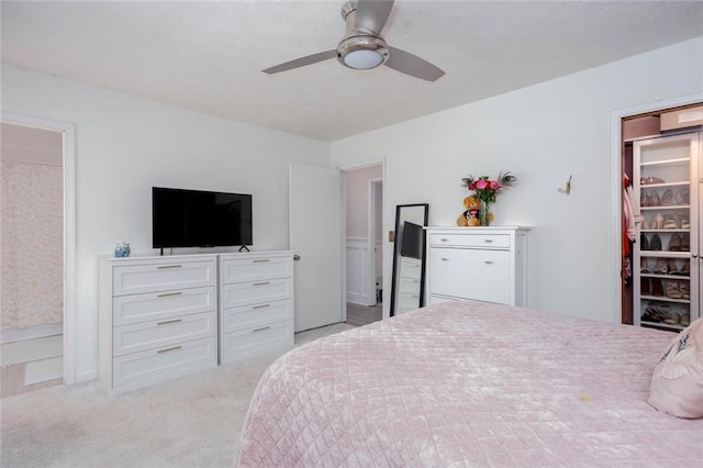 carpeted bedroom with a ceiling fan