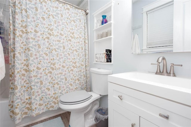 full bathroom with toilet, vanity, and shower / tub combo