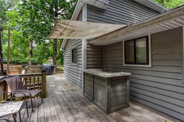 wooden terrace with grilling area