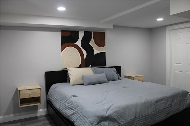 bedroom featuring dark hardwood / wood-style flooring