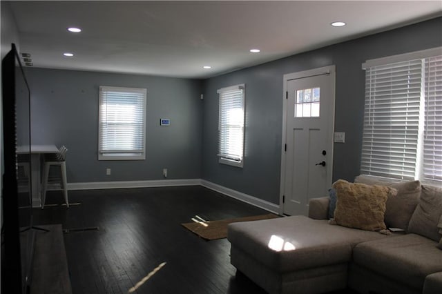 living room featuring dark wood-type flooring