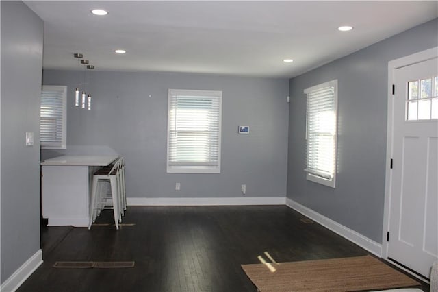 foyer with dark hardwood / wood-style floors