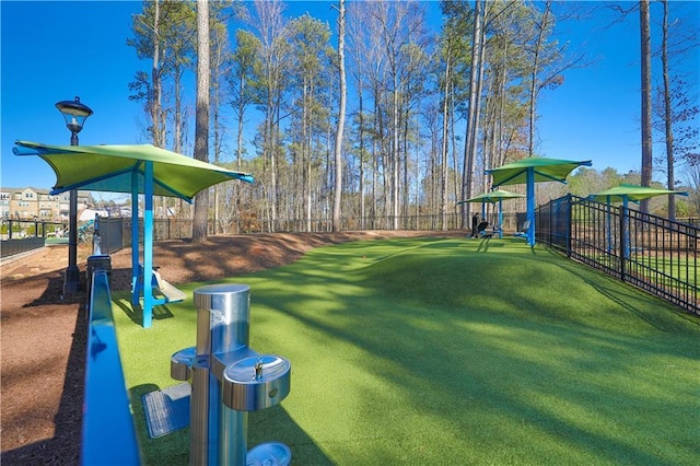 view of yard with fence and playground community