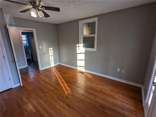 155 Cone Dr, Athens, GA 30601 - kitchen featuring dark wood finished floors, a sink, baseboards, black appliances, and white cabinetry