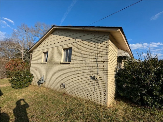 view of home's exterior featuring a lawn