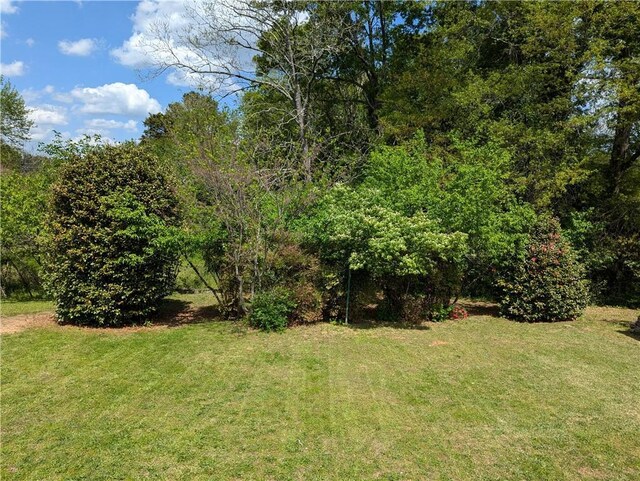 155 Cone Dr, Athens, GA 30601 - unfurnished bedroom with a ceiling fan, visible vents, wood finished floors, baseboards, and a closet
