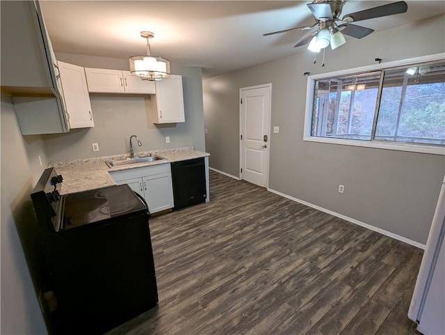 kitchen featuring white cabinets, sink, hanging light fixtures, and black appliances