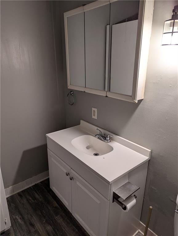 bathroom with vanity and hardwood / wood-style floors