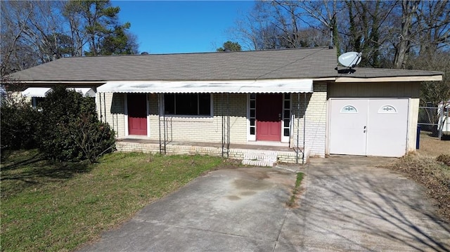 view of front of property with a garage and a front lawn