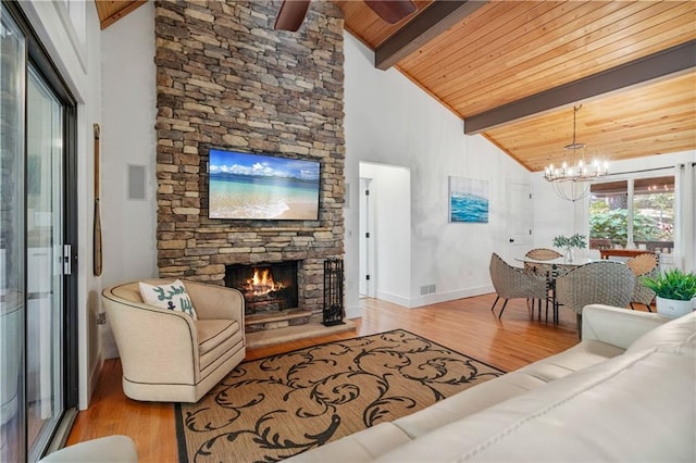 7875 Robin Rd, Cumming, GA 30041 - living room featuring wood finished floors, a fireplace, wooden ceiling with exposed beams, a chandelier, and baseboards