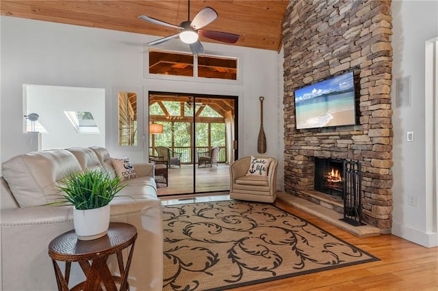 7875 Robin Rd, Cumming, GA 30041 - living area featuring a fireplace, wood finished floors, a ceiling fan, lofted ceiling, and wood ceiling