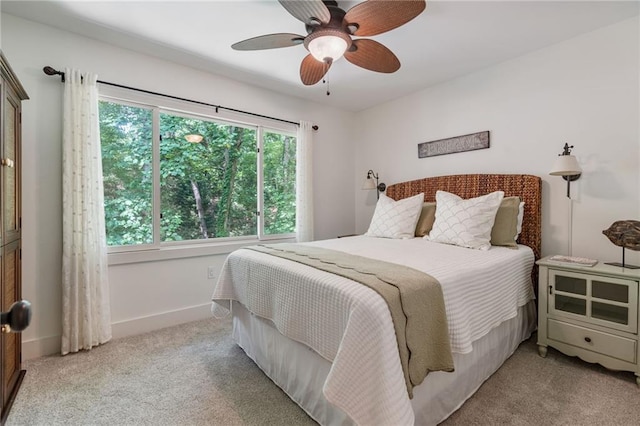7875 Robin Rd, Cumming, GA 30041 - bedroom with light carpet, baseboards, and ceiling fan