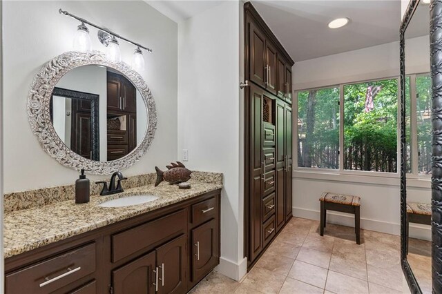 7875 Robin Rd, Cumming, GA 30041 - bathroom featuring tile patterned flooring, vanity, and baseboards