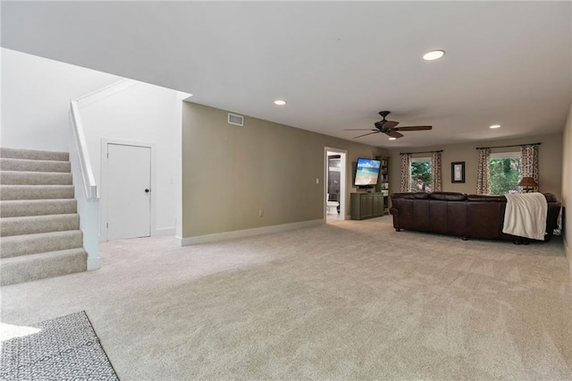 7875 Robin Rd, Cumming, GA 30041 - living room with ceiling fan, light colored carpet, stairs, recessed lighting, and baseboards