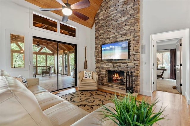 7875 Robin Rd, Cumming, GA 30041 - living area featuring wood finished floors, ceiling fan, a fireplace, high vaulted ceiling, and wooden ceiling