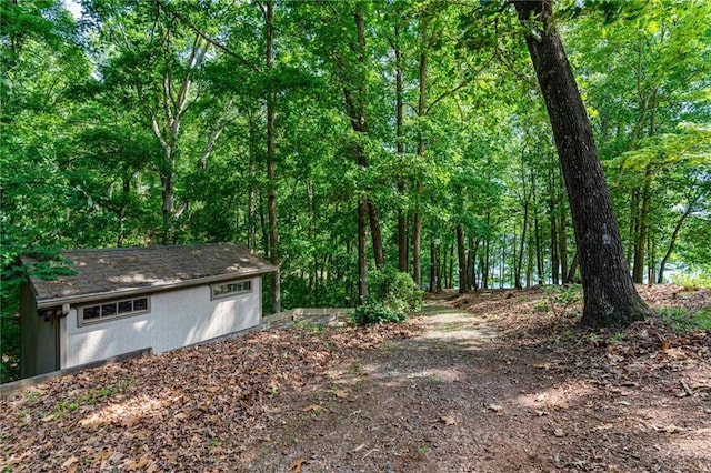 7875 Robin Rd, Cumming, GA 30041 - view of yard featuring an outdoor structure and a view of trees
