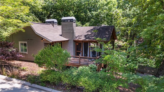 7875 Robin Rd, Cumming, GA 30041 - rear view of property with a chimney, a wooden deck, and roof with shingles