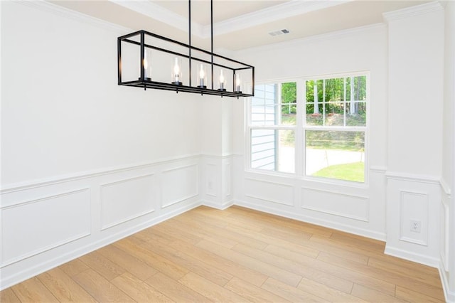 296 River Run Dr, Dallas, GA 30132 - unfurnished dining area with a chandelier, healthy amount of natural light, light wood finished floors, wainscoting, and a decorative wall