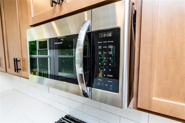 296 River Run Dr, Dallas, GA 30132 - kitchen view of stainless steel microwave and backsplash