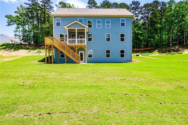 296 River Run Dr, Dallas, GA 30132 - rear view of property featuring a sunroom, a yard, and stairs