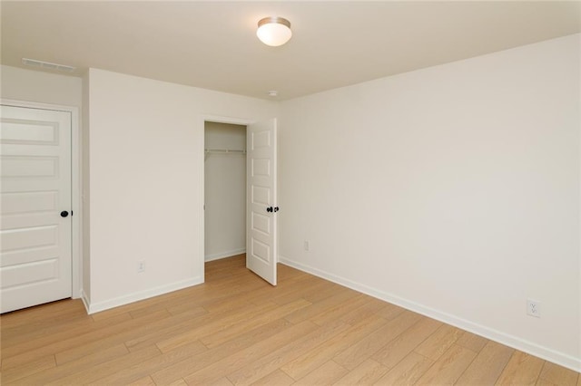 296 River Run Dr, Dallas, GA 30132 - unfurnished bedroom featuring light wood-style flooring, baseboards, and a closet