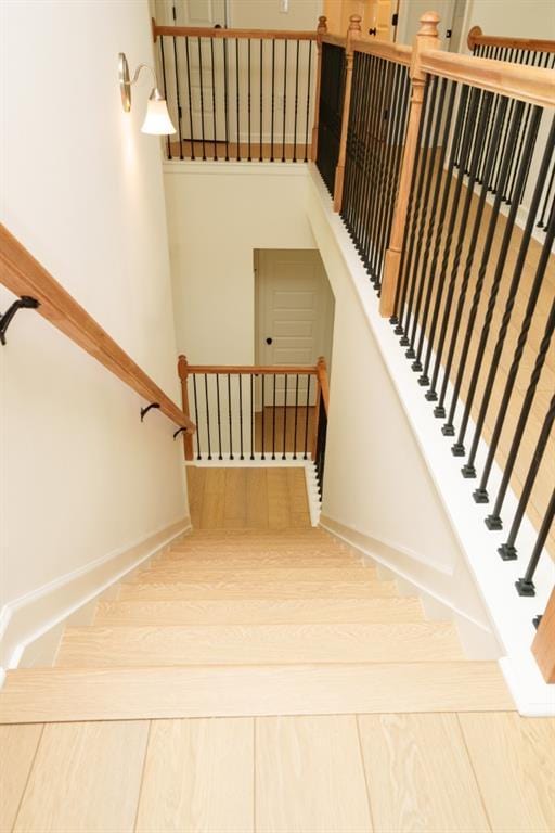 296 River Run Dr, Dallas, GA 30132 - staircase with baseboards and wood finished floors