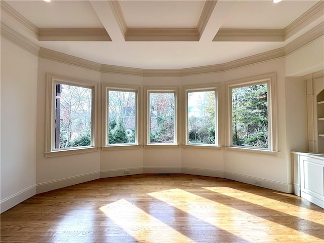 unfurnished sunroom with visible vents, beam ceiling, and coffered ceiling