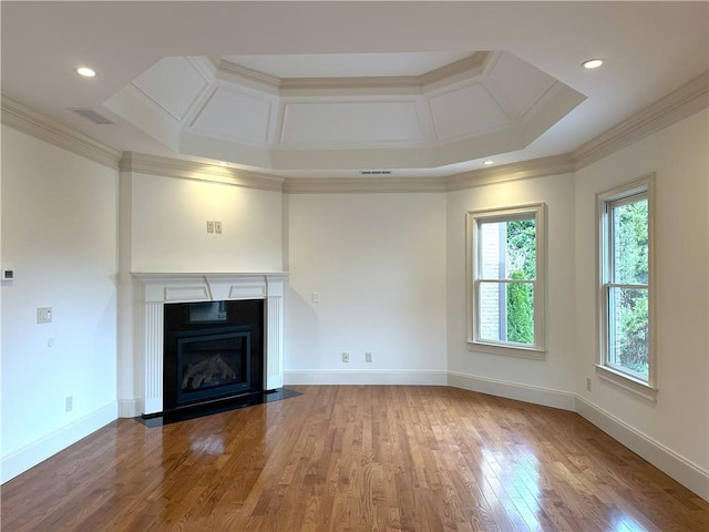 unfurnished living room with crown molding, baseboards, a fireplace with flush hearth, wood finished floors, and coffered ceiling