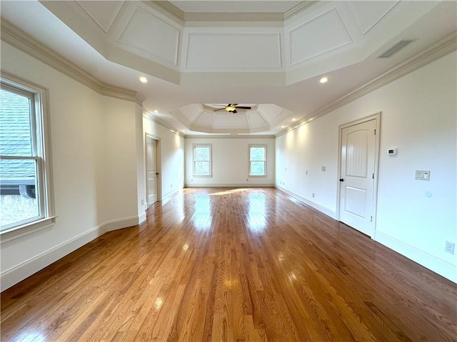 unfurnished room featuring baseboards, light wood-type flooring, crown molding, and ceiling fan