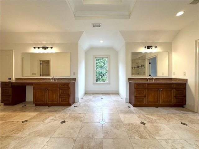 bathroom with visible vents, a sink, a tile shower, crown molding, and baseboards