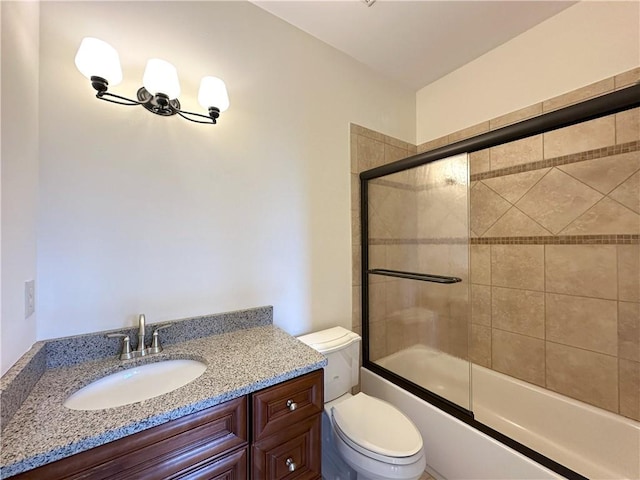 full bath with combined bath / shower with glass door, a notable chandelier, toilet, and vanity