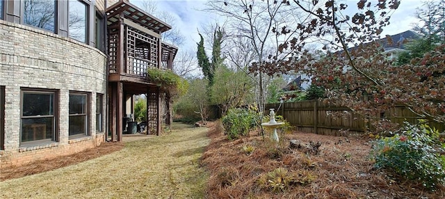 view of yard featuring stairway and fence