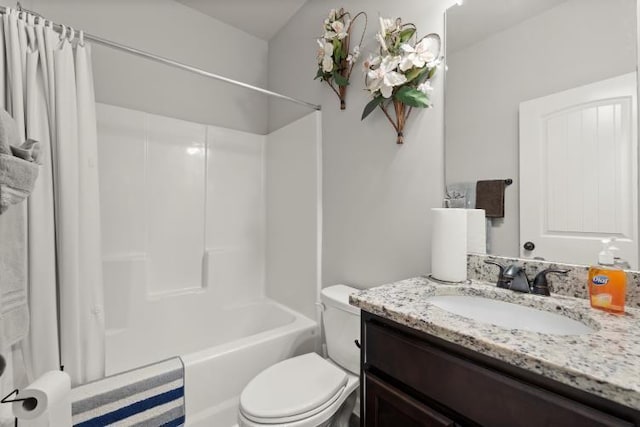 full bathroom with shower / tub combo with curtain, vanity, and toilet