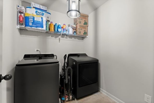 washroom with washer and dryer